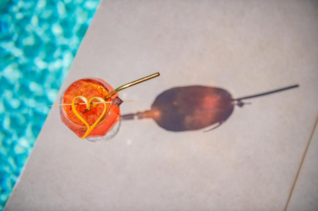 a snail and an apple with a heart on it at Nestor Luxury Villas in Romanu