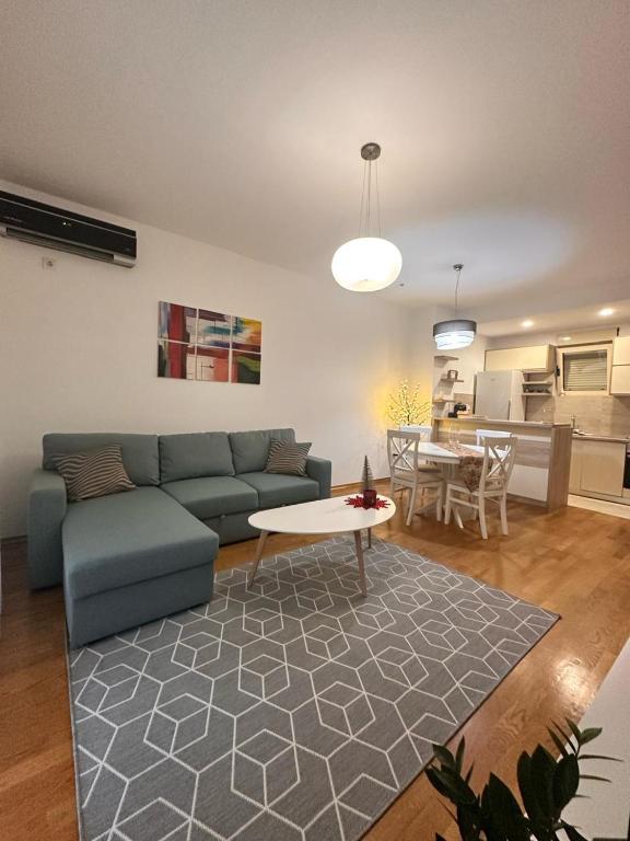 a living room with a couch and a table at Posto Capitano apartment Sasa in Kotor
