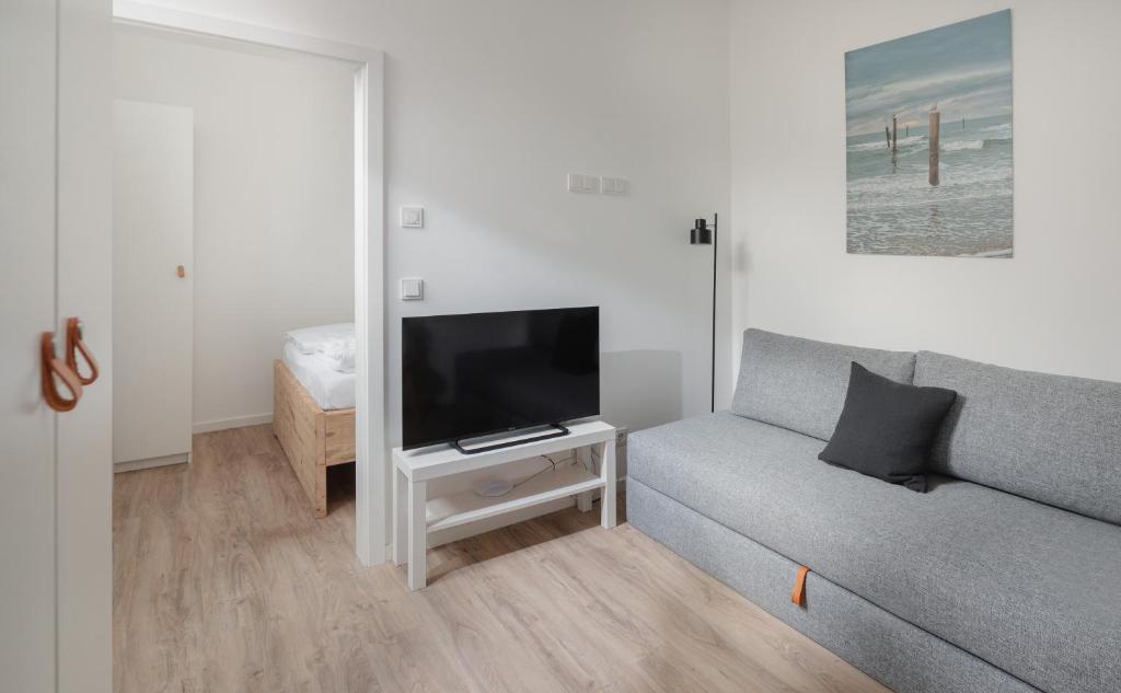 TV a/nebo společenská místnost v ubytování Strandloft VIER Norderney