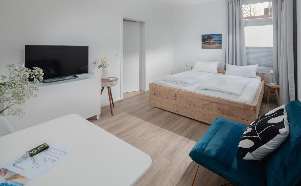 Postel nebo postele na pokoji v ubytování Strandloft VIER Norderney