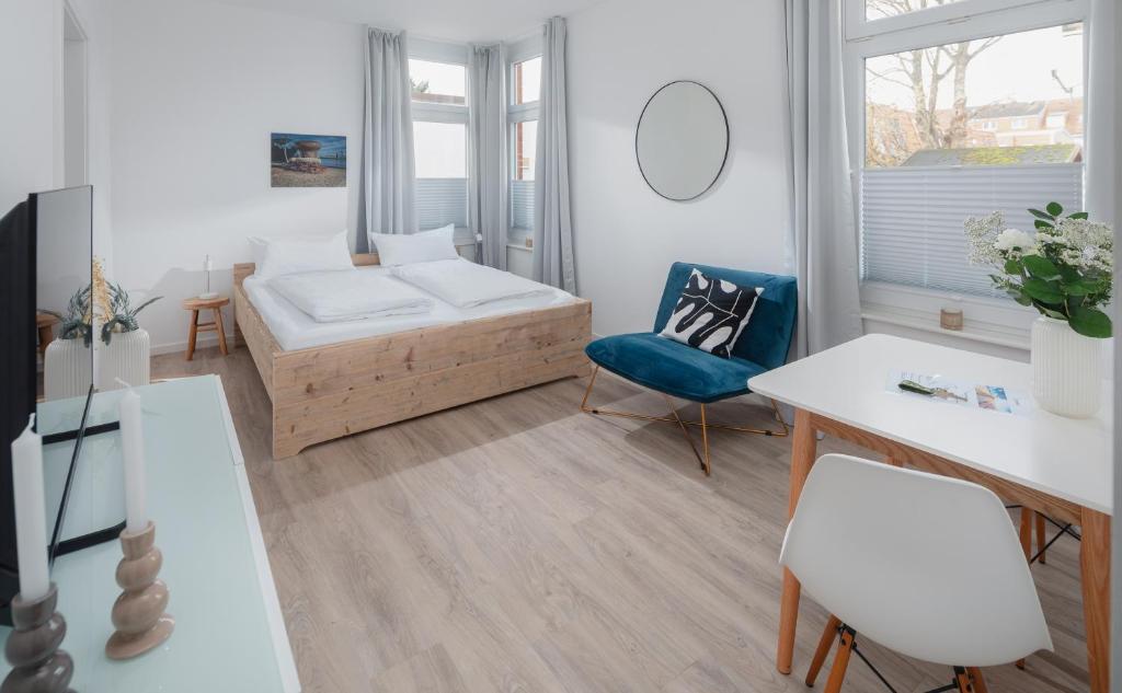 Postel nebo postele na pokoji v ubytování Strandloft VIER Norderney