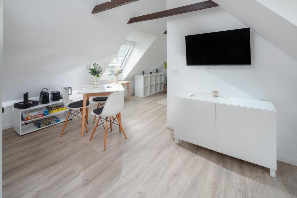 TV a/nebo společenská místnost v ubytování Strandloft VIER Norderney