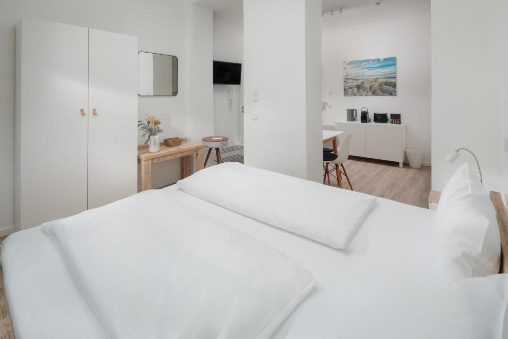 Postel nebo postele na pokoji v ubytování Strandloft VIER Norderney