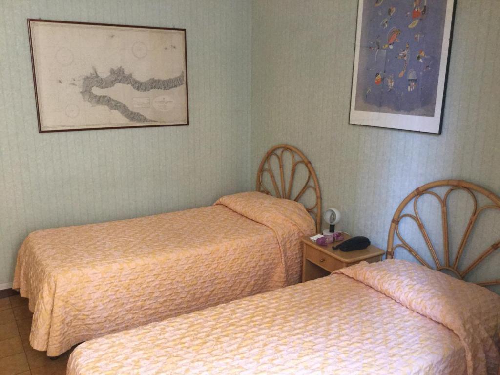 Postel nebo postele na pokoji v ubytování Hotel Touring