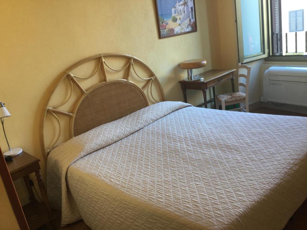 Postel nebo postele na pokoji v ubytování Hotel Touring