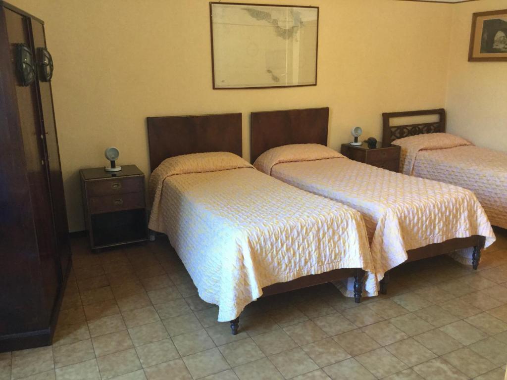 Postel nebo postele na pokoji v ubytování Hotel Touring