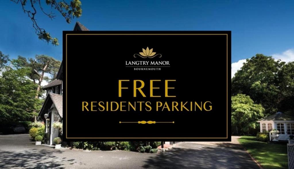 a sign that reads free residents parking in front of a house at Langtry Manor Hotel in Bournemouth