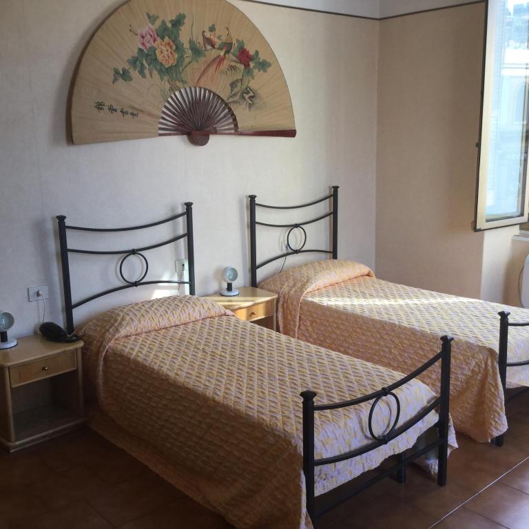 Postel nebo postele na pokoji v ubytování Hotel Touring