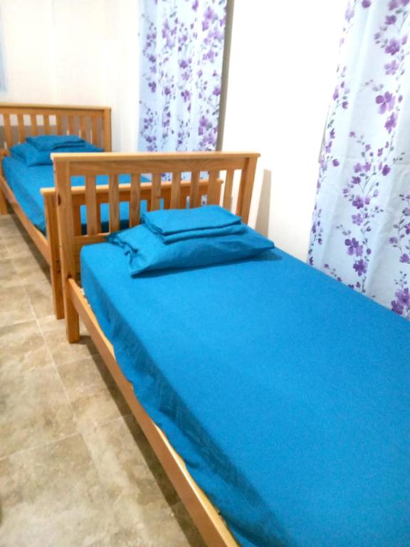 Postel nebo postele na pokoji v ubytování Casa Azul Miguel de la Borda