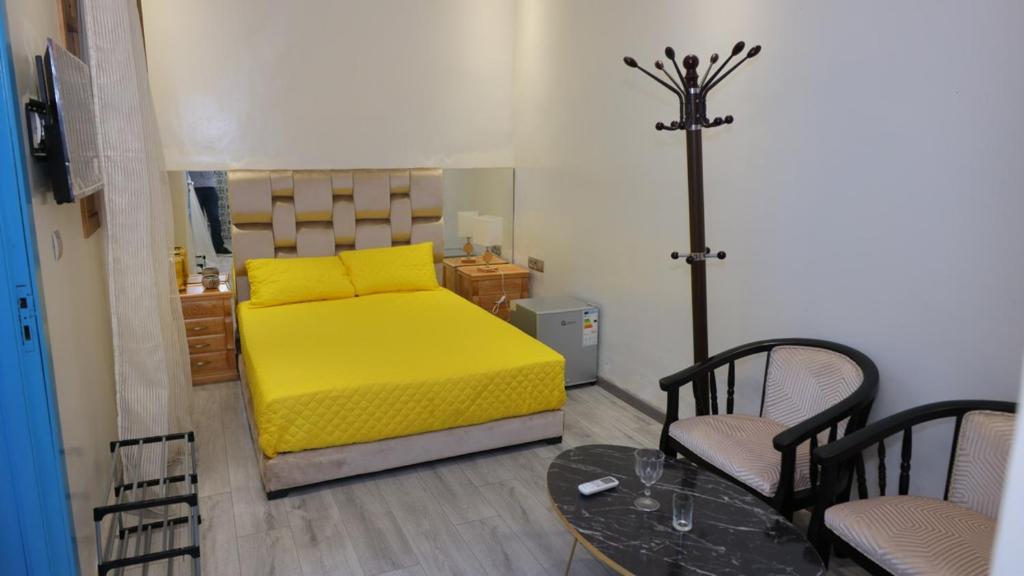 Postel nebo postele na pokoji v ubytování Riad Sevilla
