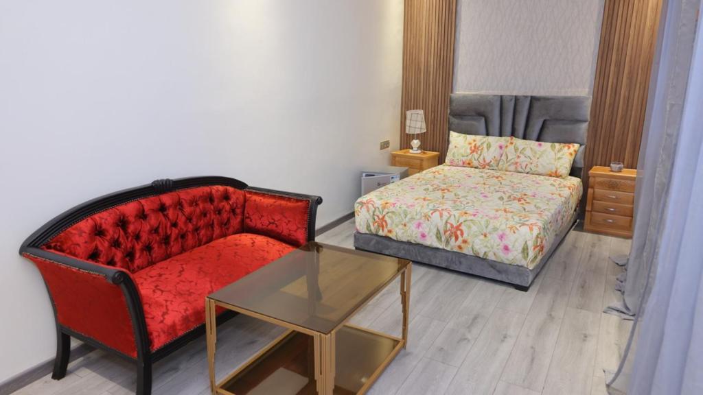 Postel nebo postele na pokoji v ubytování Riad Sevilla