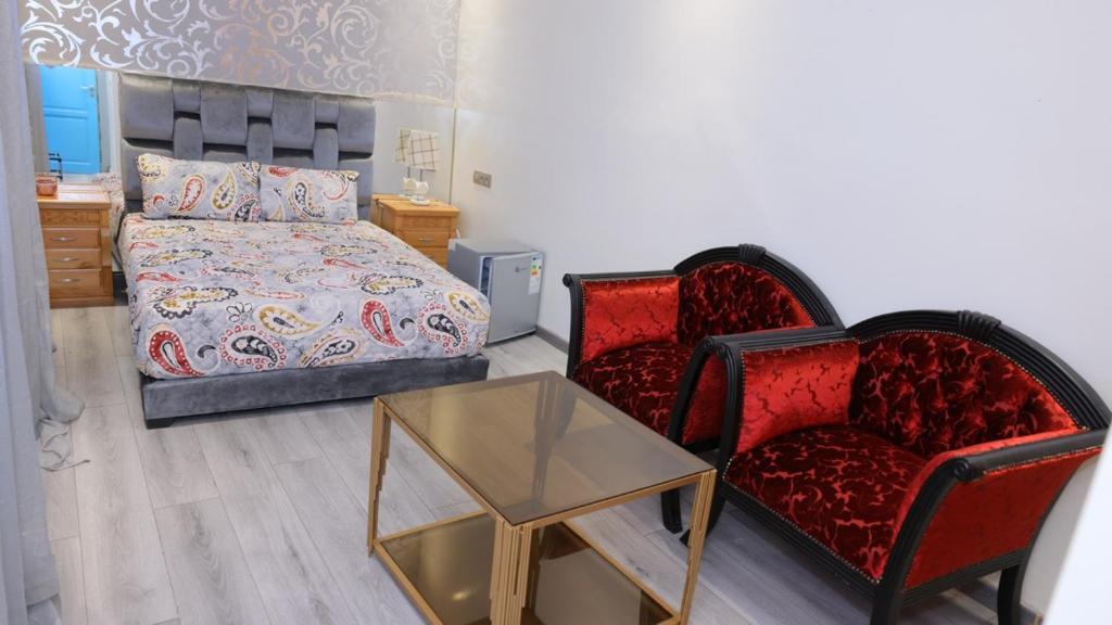 Postel nebo postele na pokoji v ubytování Riad Sevilla