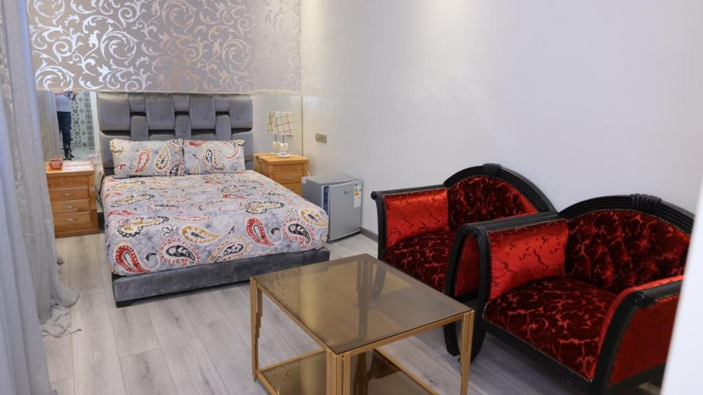 Postel nebo postele na pokoji v ubytování Riad Sevilla