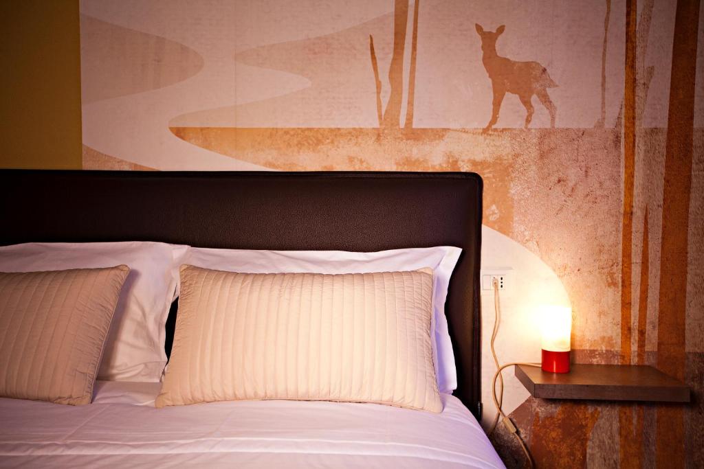 Postel nebo postele na pokoji v ubytování B&b Igea 50