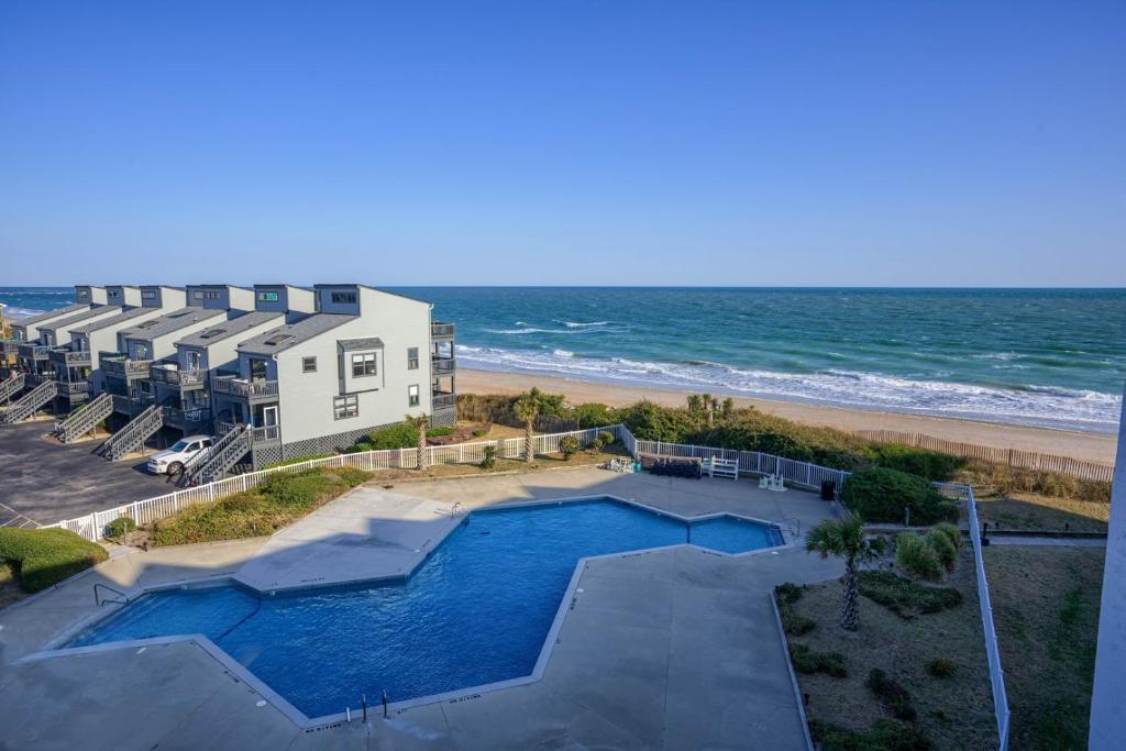 an aerial view of a house and the beach at Oceanfront Resort - Swimming Pool - Tennis in Chadwick Acres