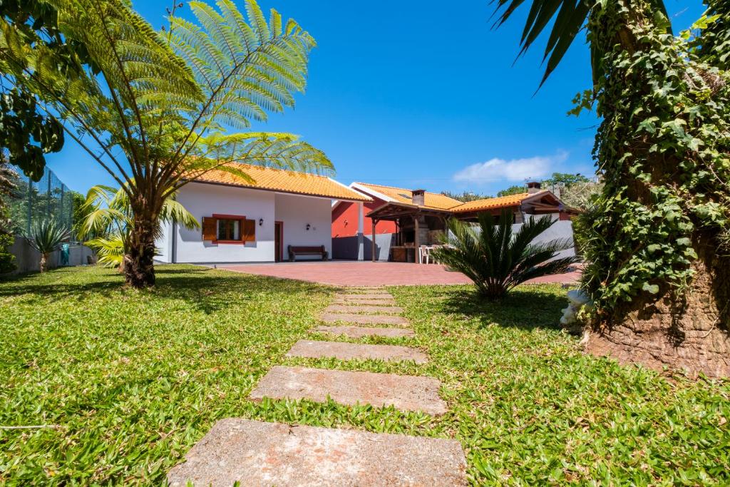 a pathway in front of a house at Casa del Mar II by GALMI in Arco de São Jorge