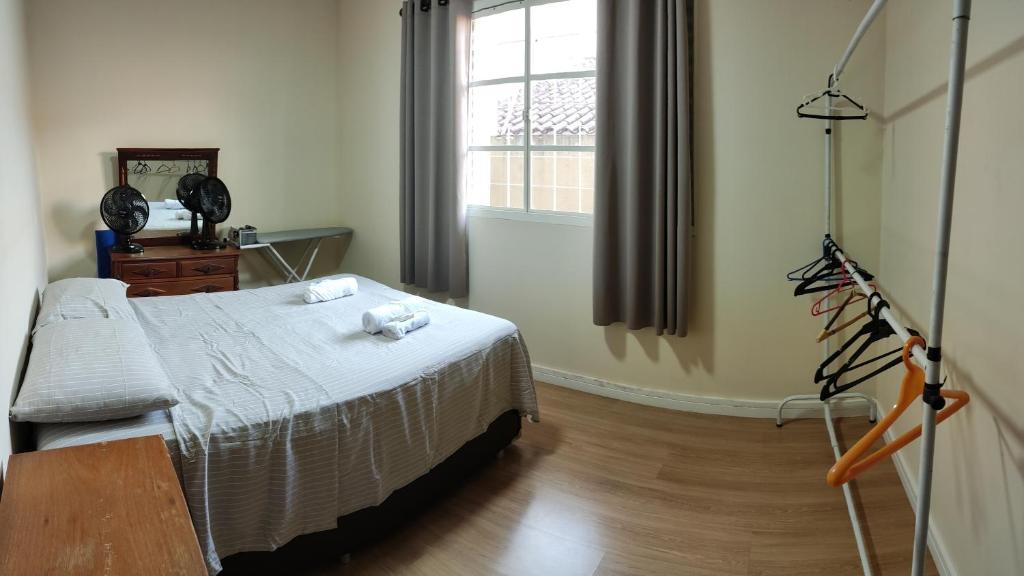 Postel nebo postele na pokoji v ubytování Casa Térrea 3 quartos, sendo 1 suíte Maringá