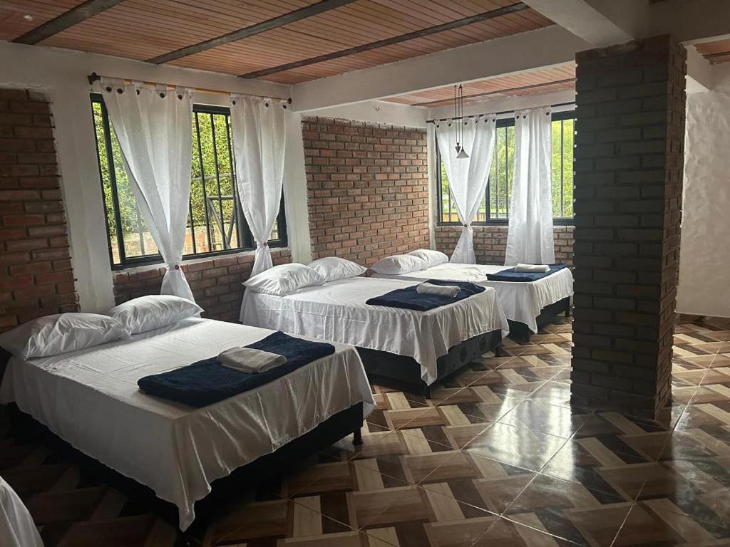 En eller flere senge i et værelse på Vacaciones Sol y Luna