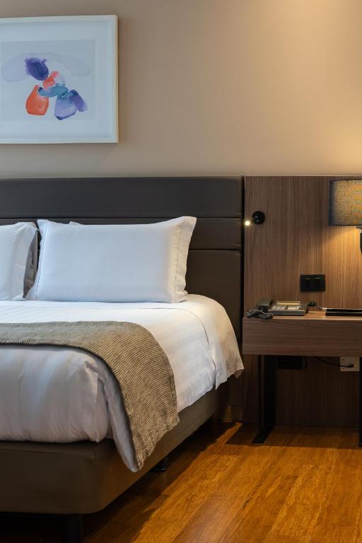 Postel nebo postele na pokoji v ubytování Estelar La Torre Suites