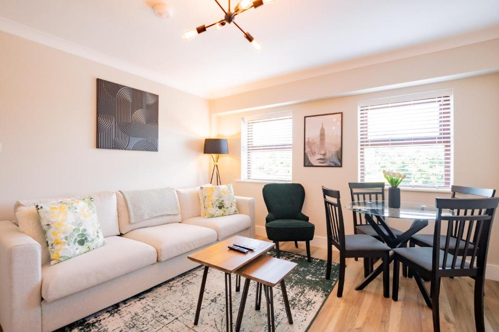 a living room with a couch and a table at Seanáras Beag in Galway