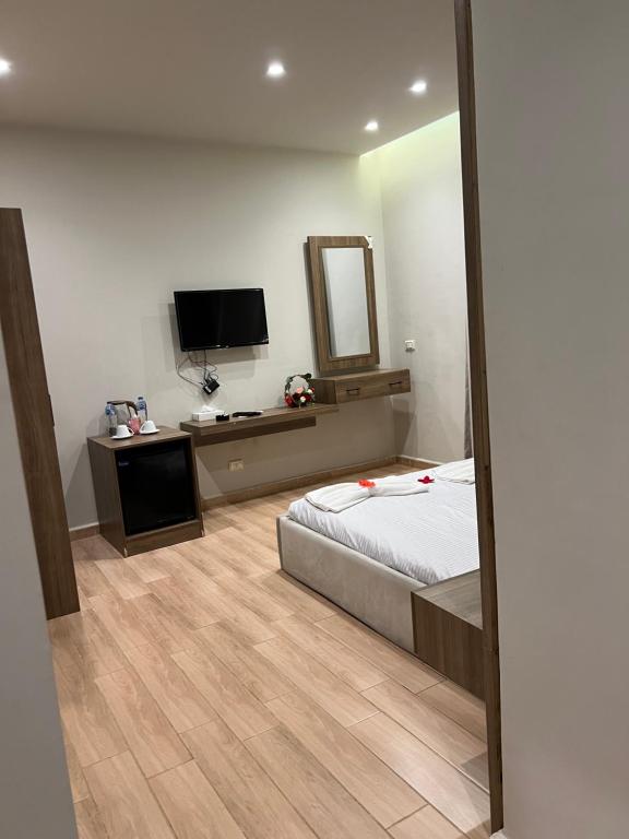 TV a/nebo společenská místnost v ubytování Magic Pyramids Hotel