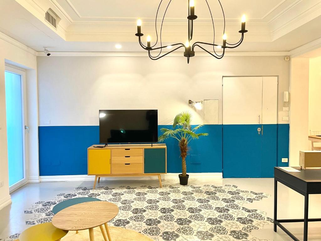 TV a/nebo společenská místnost v ubytování Le porte di Lecce Suites
