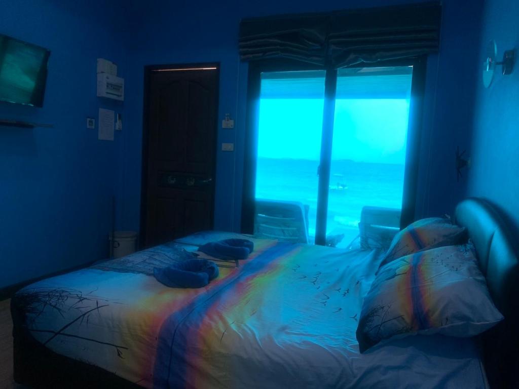 Postel nebo postele na pokoji v ubytování Koh Samed Lungdrum Hurtbeach