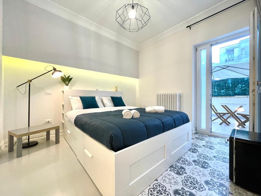 Postel nebo postele na pokoji v ubytování Le porte di Lecce Suites