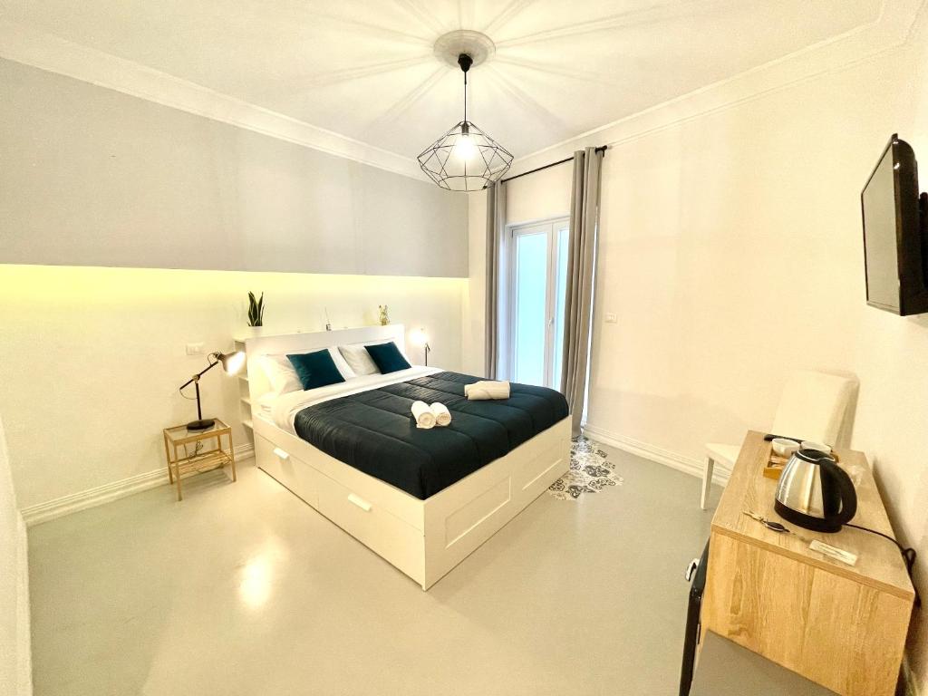 TV a/nebo společenská místnost v ubytování Le porte di Lecce Suites