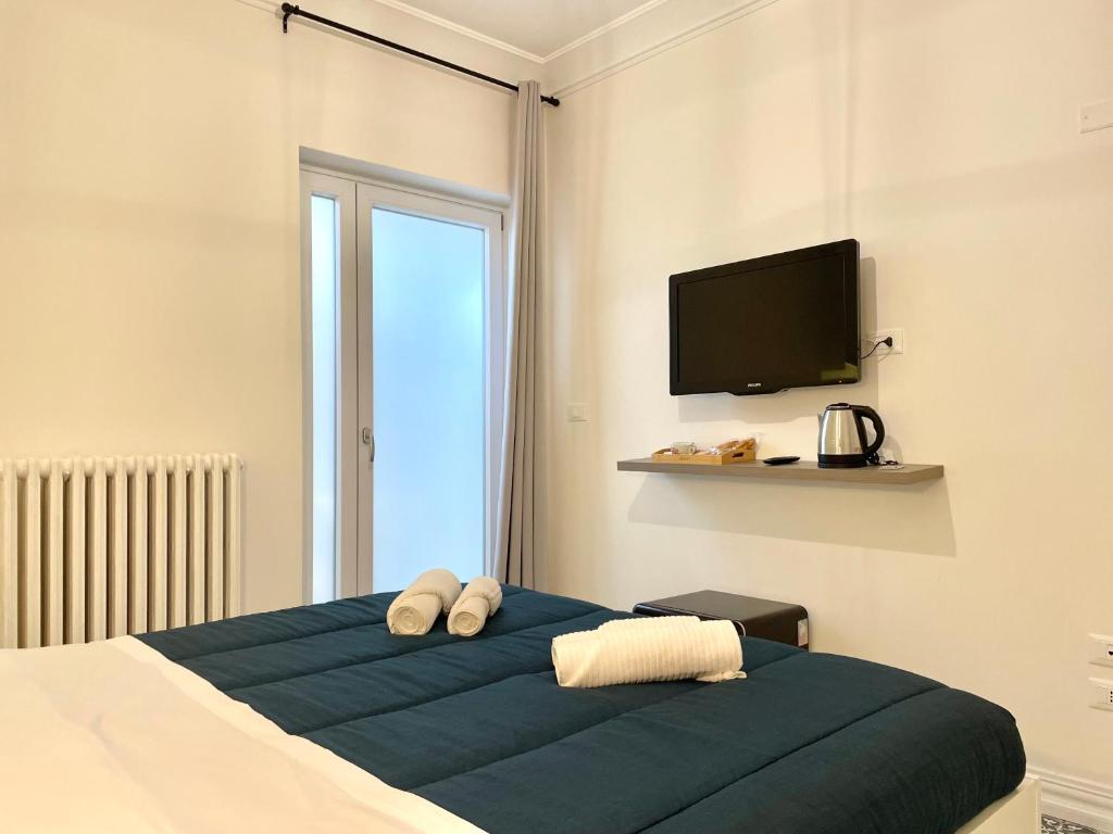 Postel nebo postele na pokoji v ubytování Le porte di Lecce Suites
