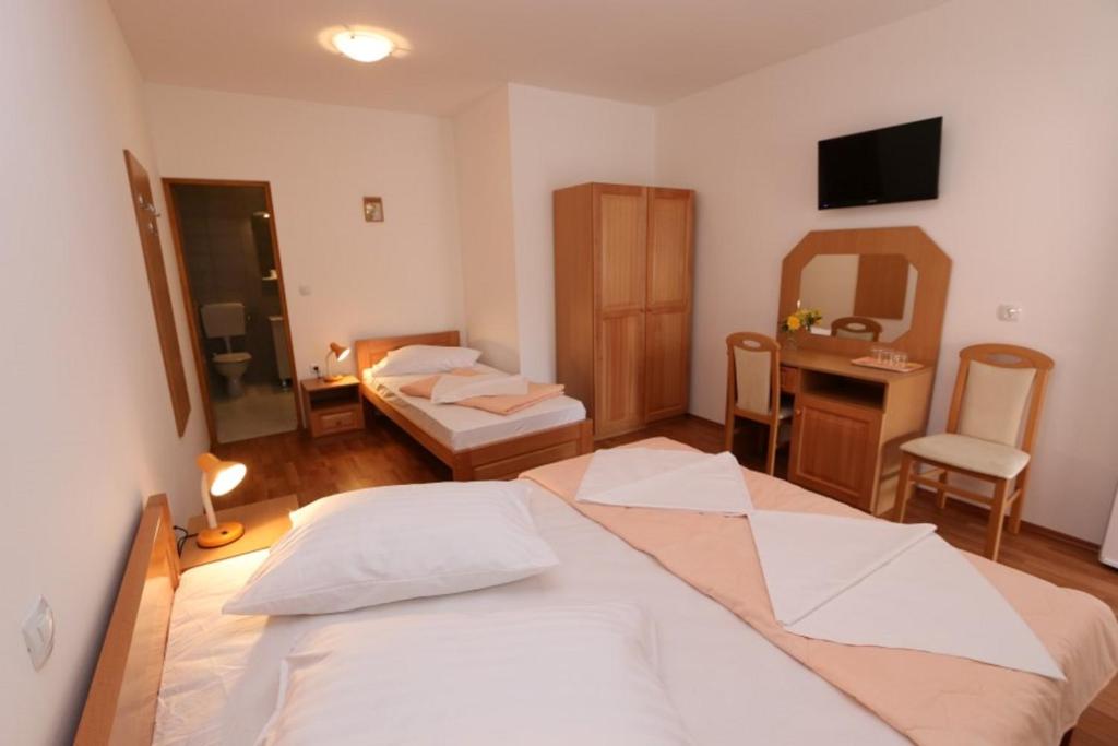 Postel nebo postele na pokoji v ubytování Pansion Comfort Sidro