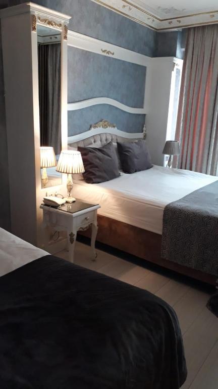 Postel nebo postele na pokoji v ubytování Leyenda Boutıque Hotel