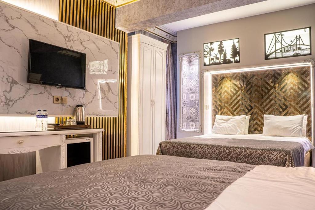 Postel nebo postele na pokoji v ubytování Leyenda Boutıque Hotel