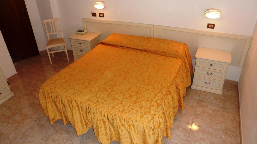 Postel nebo postele na pokoji v ubytování Hotel Reali