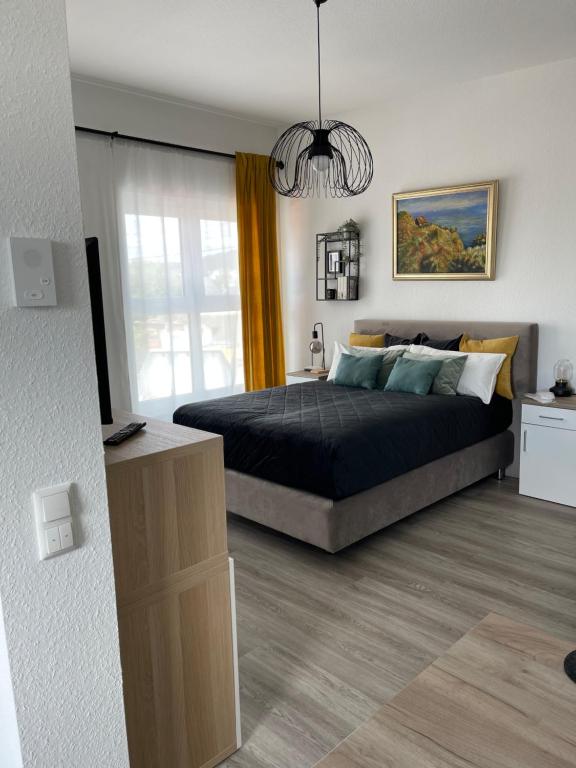 a bedroom with a large bed and a window at Appartement Nr 32 in Mayen in Mayen