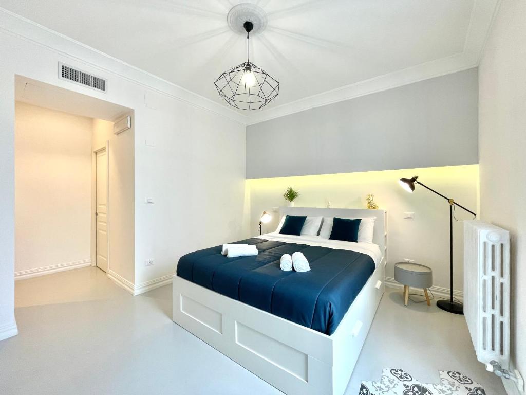 Postel nebo postele na pokoji v ubytování Le porte di Lecce Suites