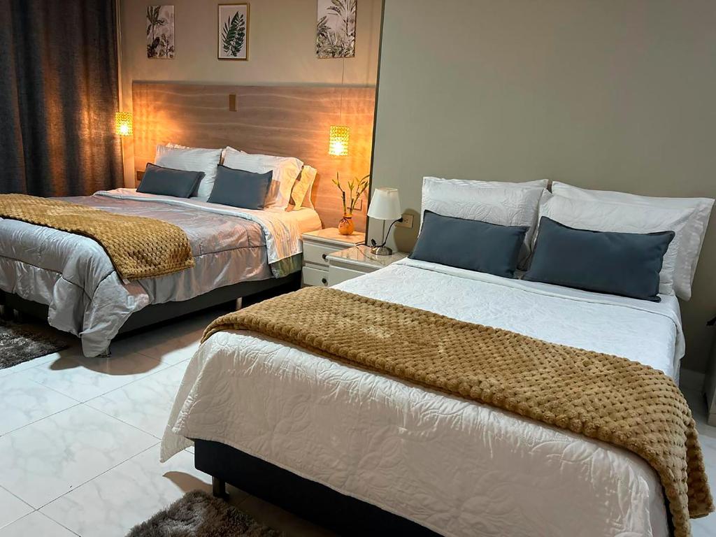 Postel nebo postele na pokoji v ubytování Provenza Medellin Hotel Boutique