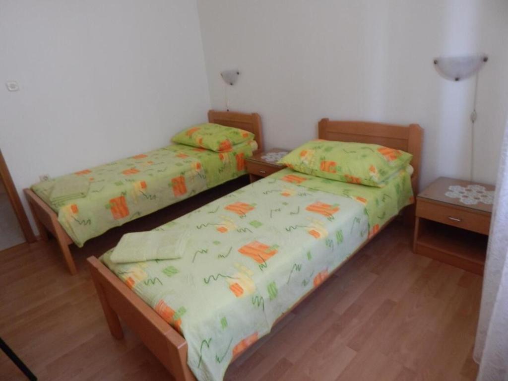 Postel nebo postele na pokoji v ubytování Apartments Zoki
