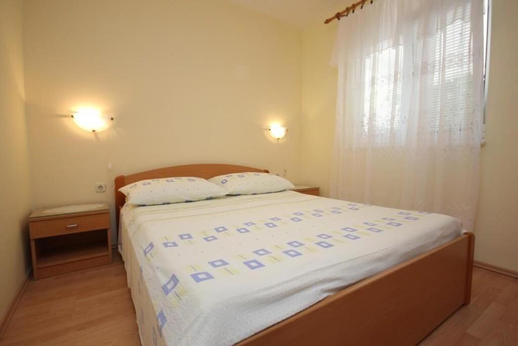 Postel nebo postele na pokoji v ubytování Apartments Zoki