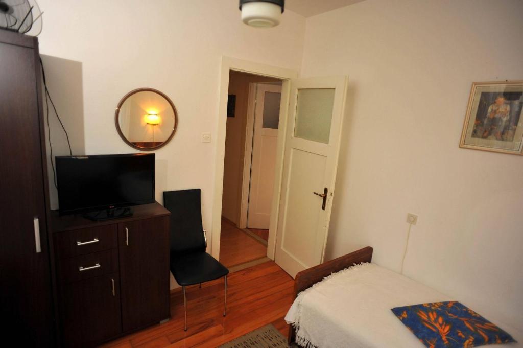 Postel nebo postele na pokoji v ubytování Apartments Piv