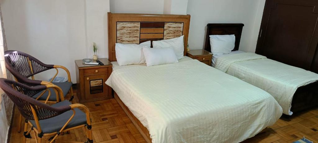 Postel nebo postele na pokoji v ubytování LA Luna Hotel DOWNTOWN
