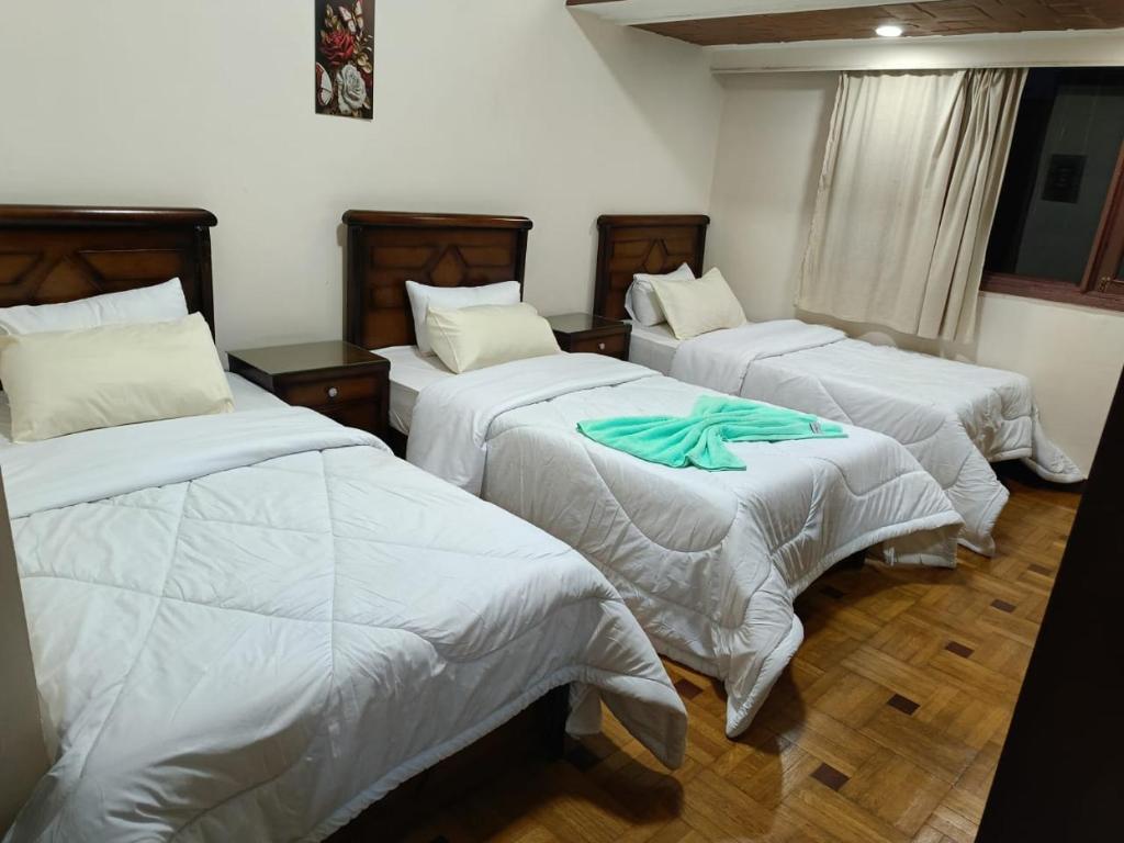 Postel nebo postele na pokoji v ubytování LA Luna Hotel DOWNTOWN