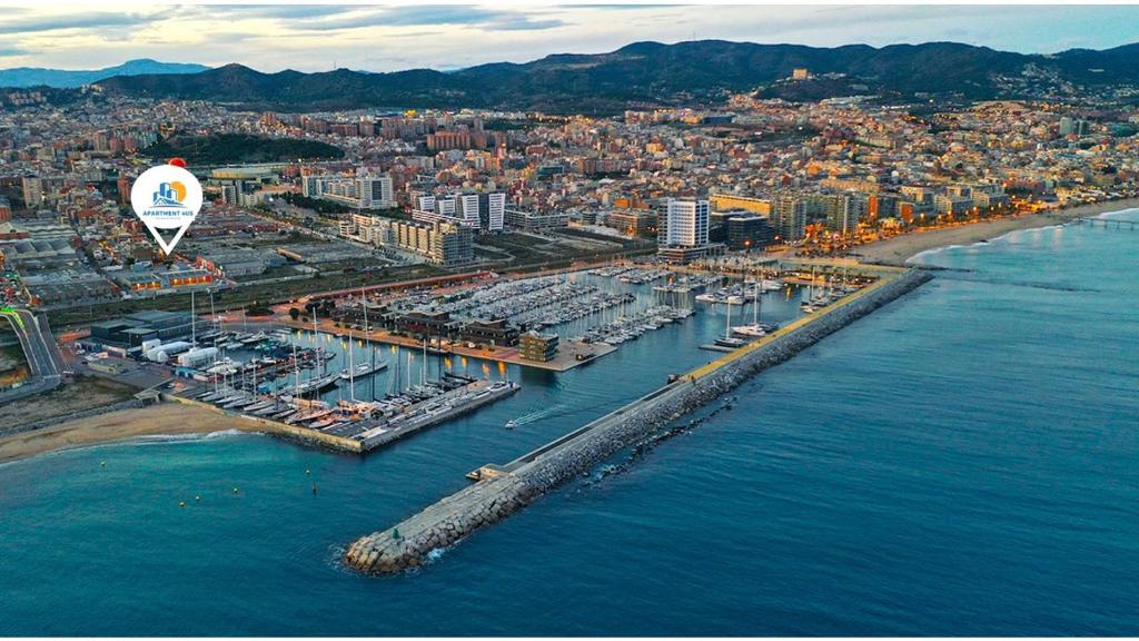 an aerial view of a harbor with a hot air balloon at Ap4Us B1 - Apartment for us - Sightseeing & Beach near to Barcelona in Badalona