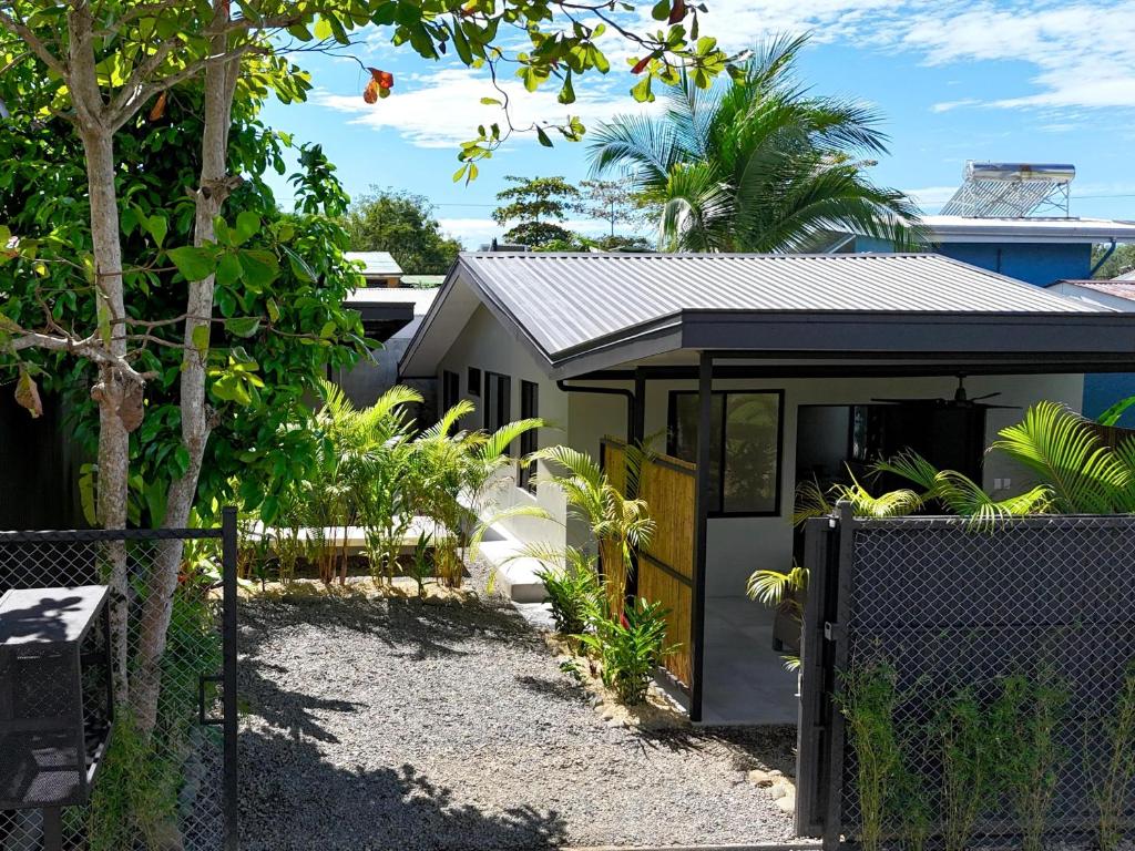 a small house with a fence in front of it at Private Tail House centre Uvita in Uvita