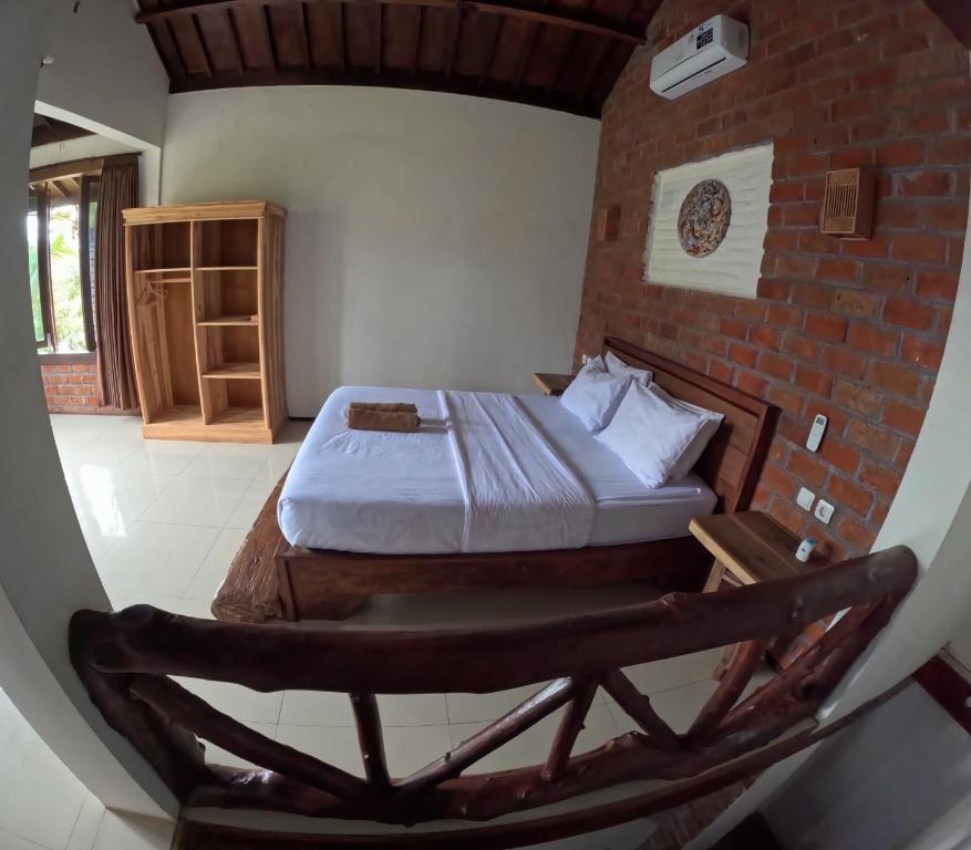Postel nebo postele na pokoji v ubytování Mu Homestay
