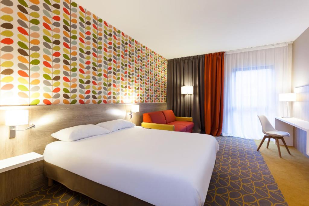 Postel nebo postele na pokoji v ubytování ibis Styles Chaumont Centre Gare