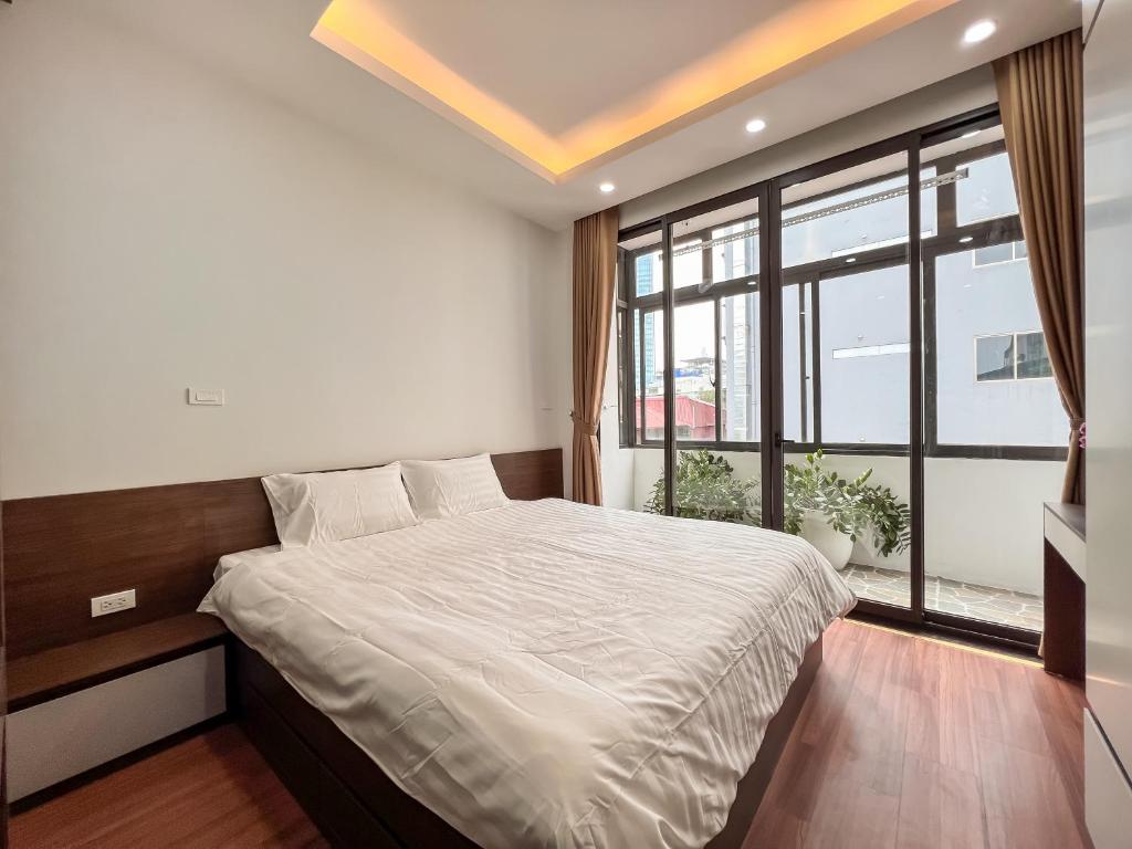 Postel nebo postele na pokoji v ubytování NINE HOUSING 49 Linh Lang