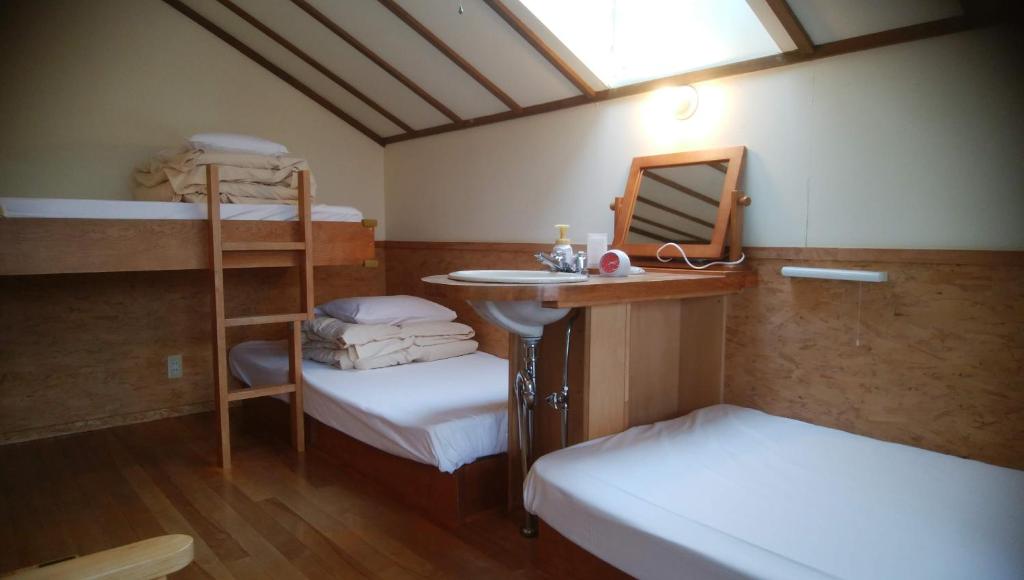 Postel nebo postele na pokoji v ubytování Pension Raclette