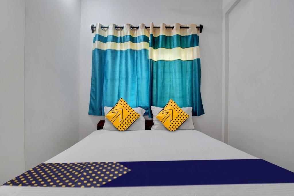 Postel nebo postele na pokoji v ubytování Hotel O U & I LIVINGS