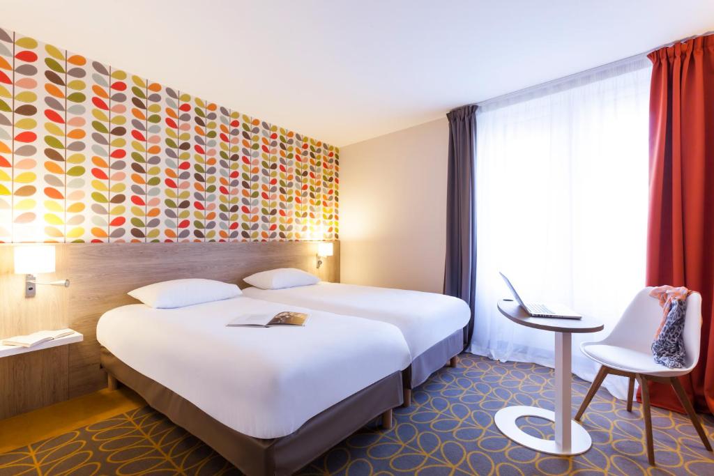 Postel nebo postele na pokoji v ubytování ibis Styles Chaumont Centre Gare